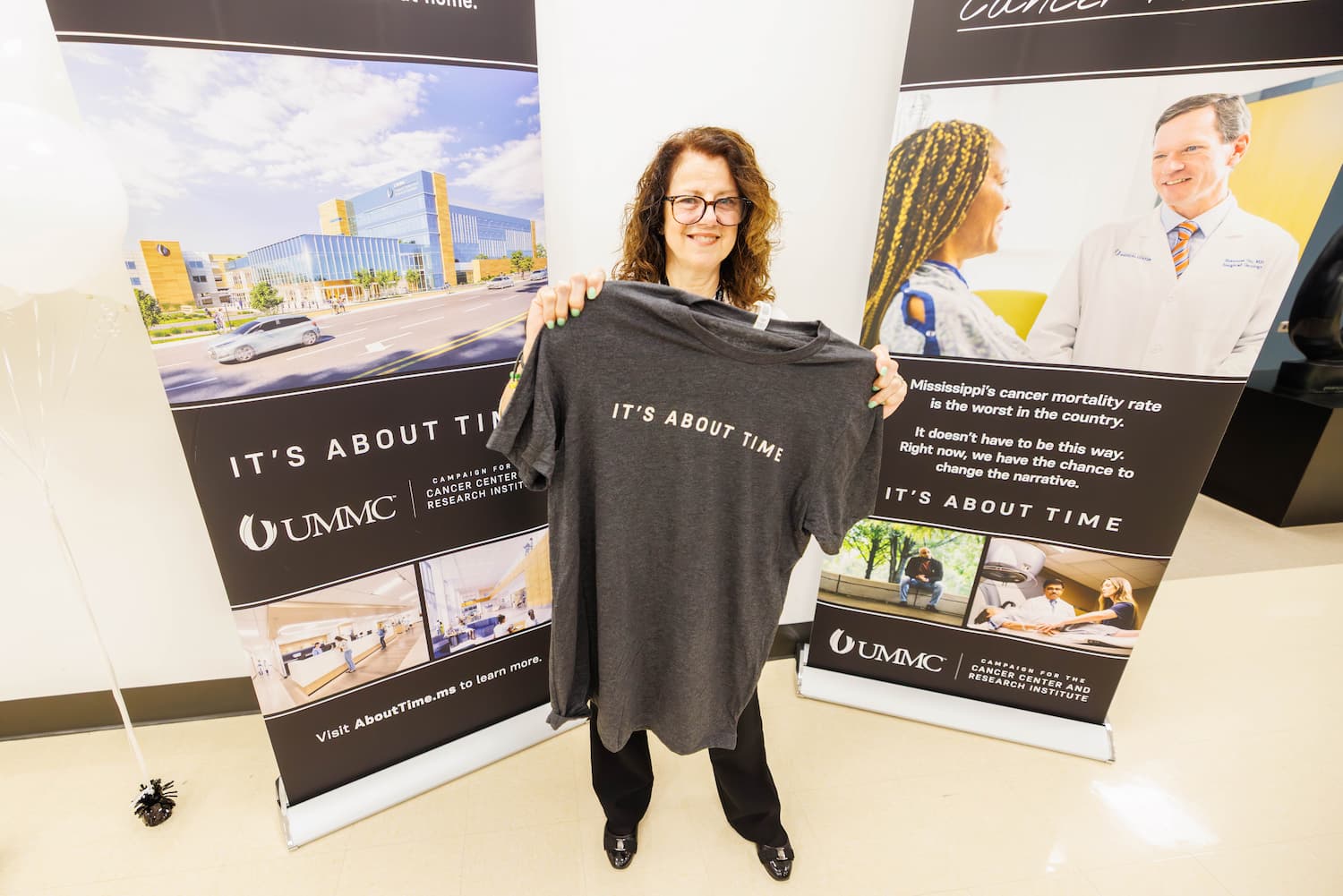 Susan Roberts shows her It's About Time T-shirt.