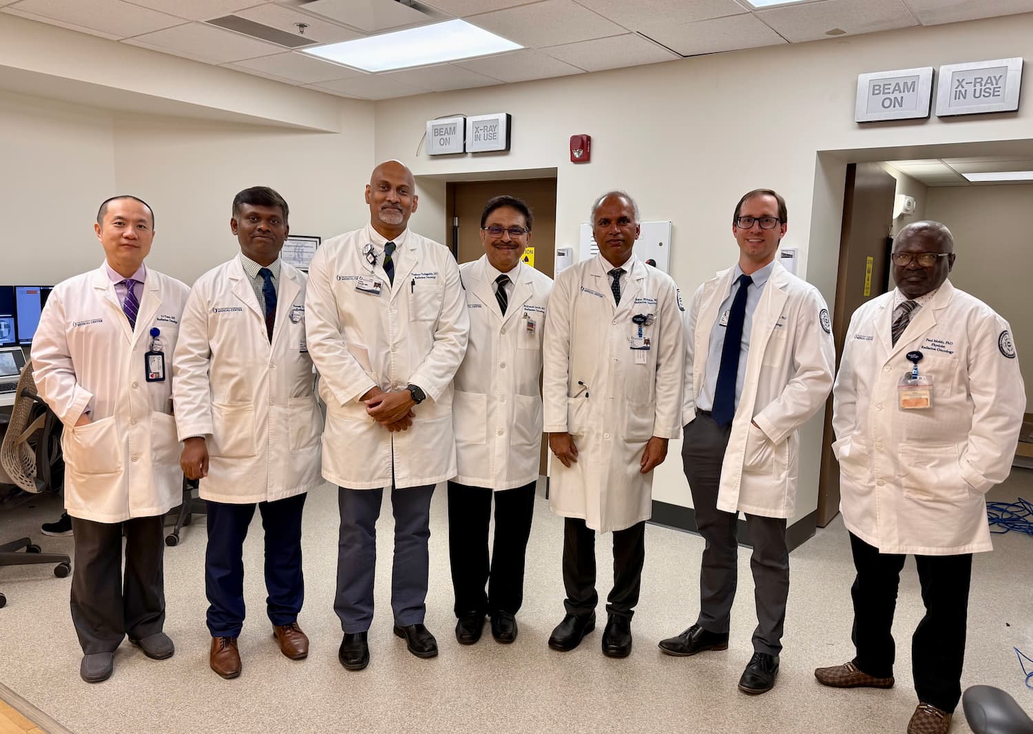 Radiation Oncology faculty members smile after training on the Varian Ethos system.