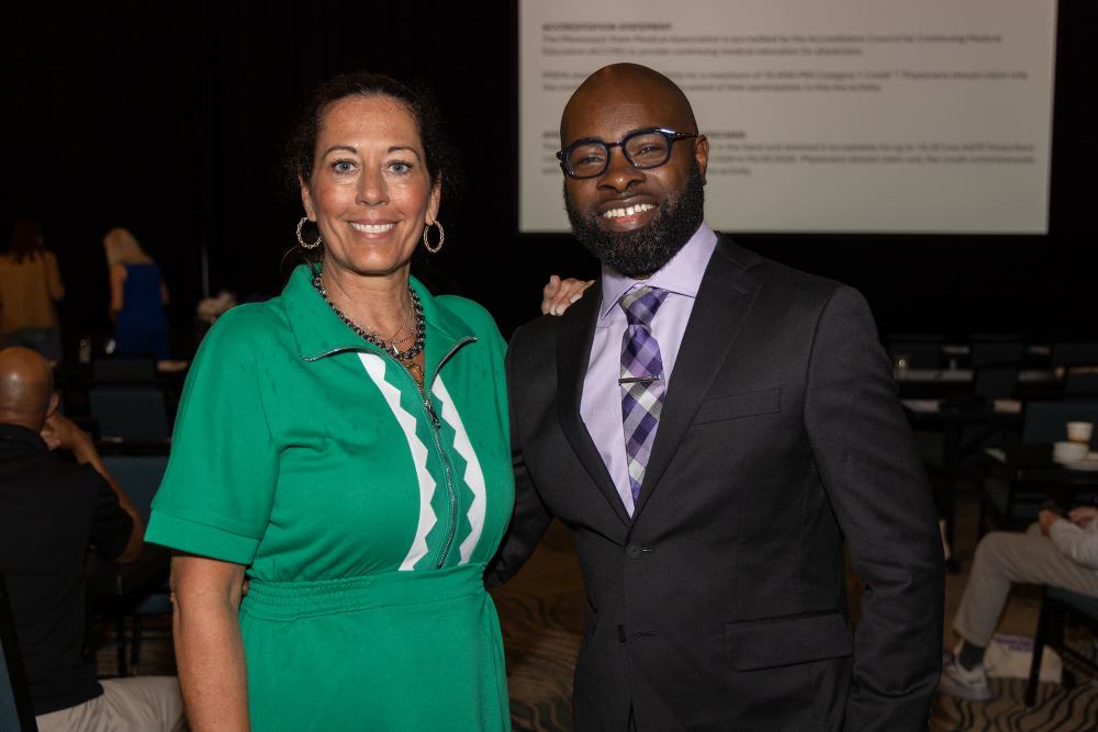 Amy Ellis, American Cancer Society strategic partnerships manager, and Dr. Justin Turner smile at the 24th annual Summer CME of the Mississippi State Medical Association.