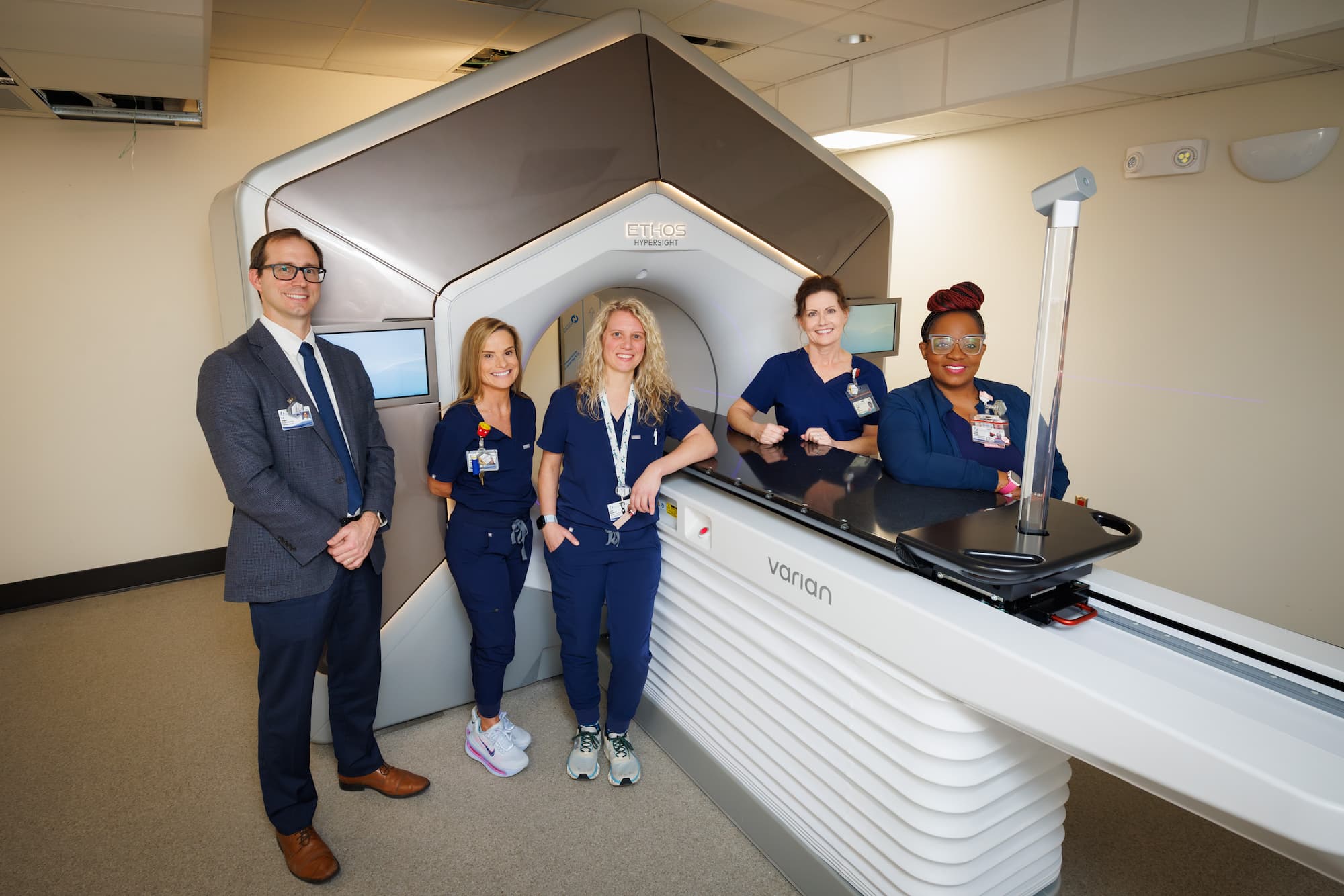 Members of our Radiation Oncology team stand by the new Varian Ethos system, which will be operational in April.