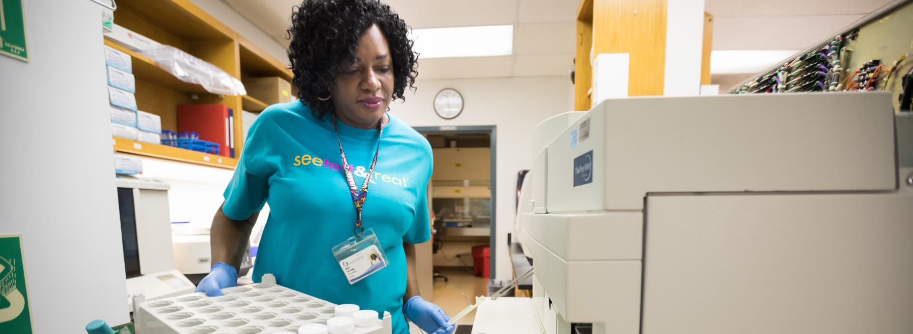 Cytotechnician Diane Catchings processes patient's Pap test samples.