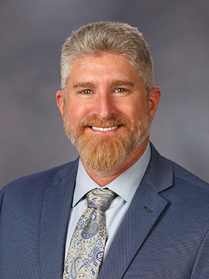 Dr. Michael Garrett in business attire