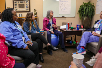 Centering Advisor Liz Stern leads a group of MEWI facilitators.