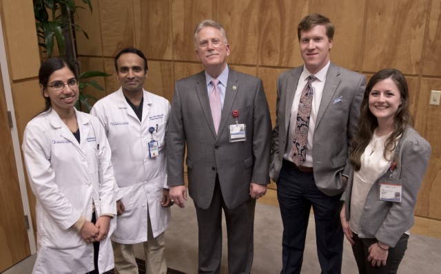 Marshall, center, stands with Department of Medicine award winners, from left, Kumar, Salim, Halinski and Mercier.