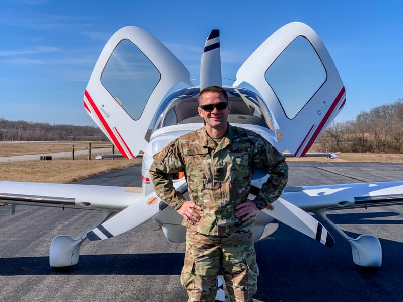 Craig Mathis, director of cardiothoracic surgical operations at UMMC, is the first and only Air Force Aerospace NP in the state. He stands by a Cirrus SR22, the aircraft he piloted in multiple sorties during the final stage of his training.