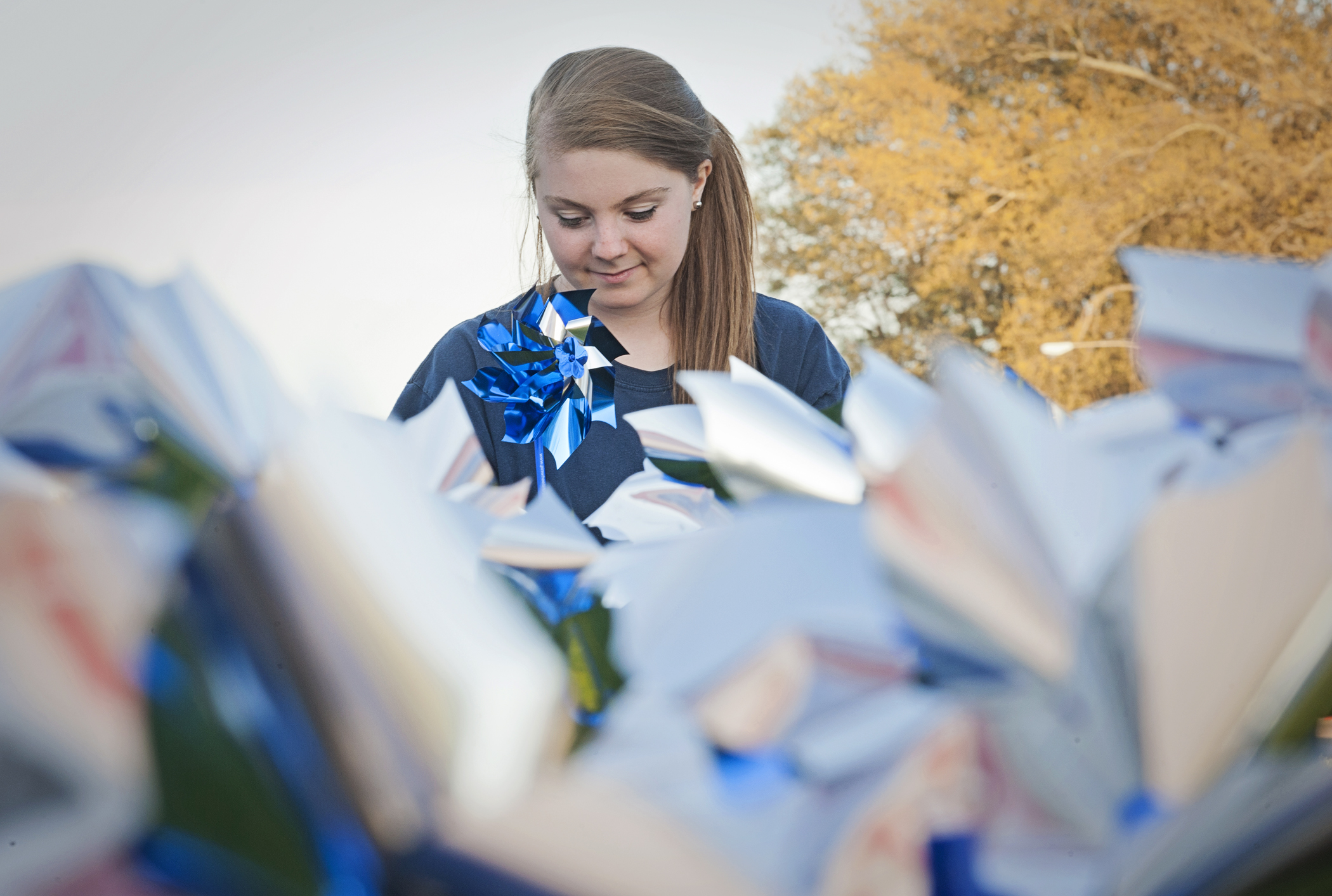   Corissa Lambert, of Alpine, Ala., a Kappa Delta sorority member from Millsaps College, plants pinwheels at UMMC on April 1 in recognition of Child Abuse Prevention Month.