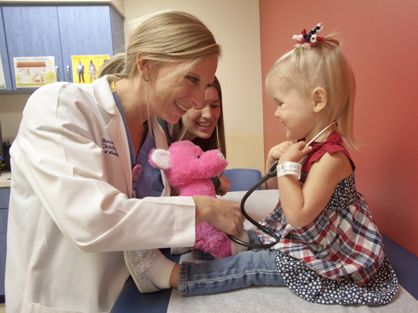 UMMC nurse practitioner Keli Ballard lets 2-year-old Abigail Morgan of Biloxi listen to her heart during a checkup exactly one week after the toddler's heart repair