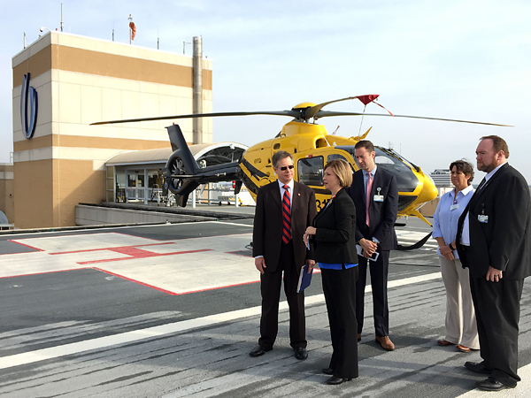 Woodward (second from left), gives Vitter (left), a tour of the Medical Center's AirCare helipad. Assisting are Dr. Brian Rutledge (center), Woodward's chief of staff; Donna Norris, MED-COM clinical director; and chief administrative officer Jonathan Wilson.