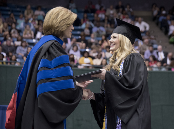 Dr. Kim Hoover, dean of the School of Nursing, gives the Christine L. Oglevee Memorial Award to Carsyn Byars of Magee.
