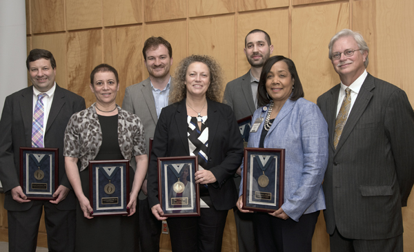 Standing with Summers, right, are 2015 Bronze Award recipients from left, Romero, Levenson, Vallender, Coolen, Harmancey and Beech.