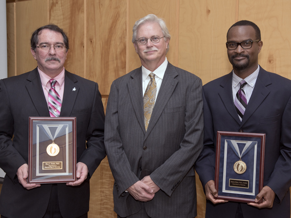 Standing with Summers, center, are 2015 Gold Award recipients Duhe, left, and Sims.
