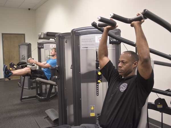 Turner strengthens his upper body muscles during a workout at the University Wellness Center's downtown Jackson facility.