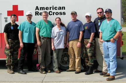 A survey team of Mississippi State Department of Health and UMMC personnel, including Wilson, second from right, pause during its trip to the Mississippi Gulf Coast.