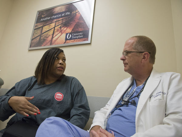 Wynn checks in Pegues during a follow-up visit to her June 9 surgery.