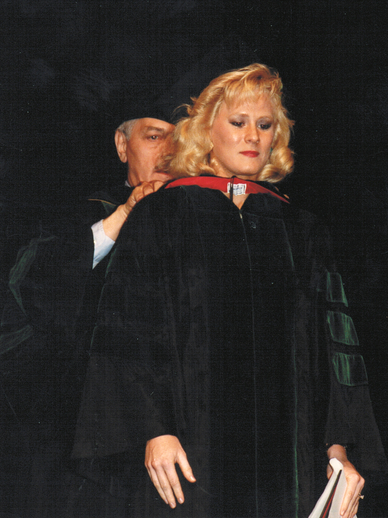 Dr. Toni Bertolet is hooded by Dr. Carl Evers after she received her Doctor of Medicine diploma in 1988.