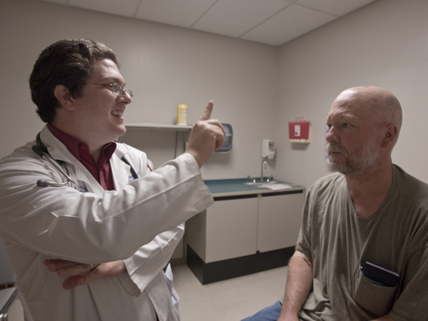 Anderson checks Newman's neurological response to some simple tests at a recent checkup.