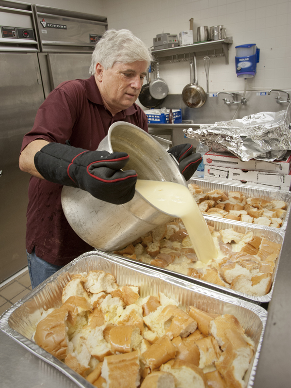Granger adds the sweet ingredients to make the bread pudding for his school's annual Holiday Open House.