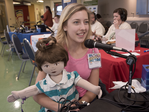 Mullen has one of Batson Children's Hospital's MediKin teaching dolls to show on-air personalities.