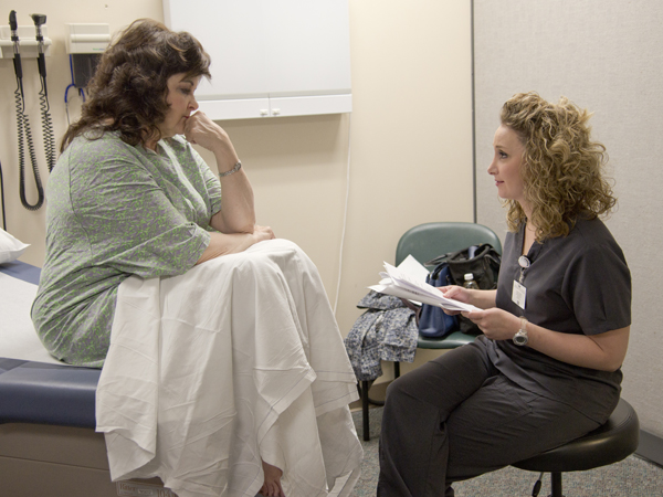 OT2 Devin Hart, right, gives her patient practical advice on ways she can cope with anxiety.