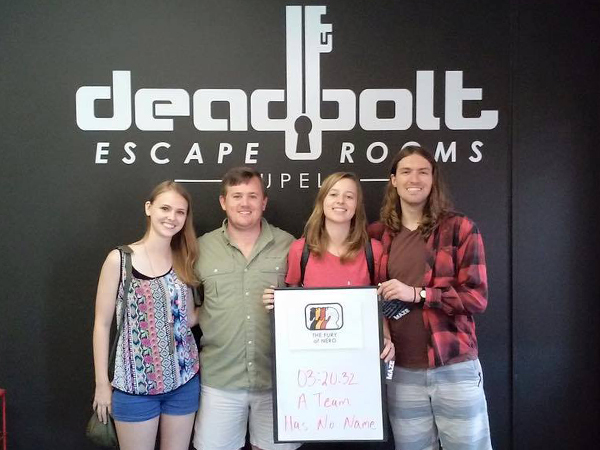 Team members, from the left, dental students Alyssa Swenson and Ronald Young join Sistrunk and his wife Paulina to conduct "business research" at Deadbolt in Tupelo as team "A Team Has No Name."