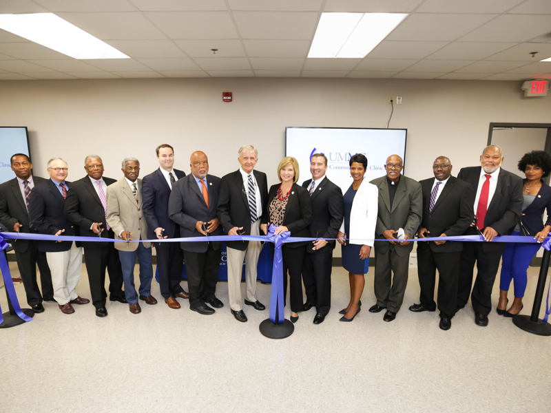 Cutting a ribbon to celebrate UMMC’s Community Care Clinic are, from left, G. Gary Jones, Buck Clarke, Willie Simmons, Rufus Straughter, Will Simpson, U.S. Rep. Bennie Thompson, Dickie Stevens, Dr. LouAnn Woodward, Kevin Cook, Dr. Tonya Moore, Morris Allen, Dr. Claude Brunson and Willie Bailey.