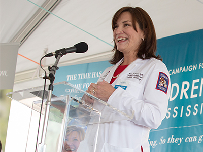 Dr. Mary Taylor, professor and Suzan B. Thames Chair of Pediatrics, smiles as she addresses attendees at the groundbreaking of a new $180 million children's tower.
