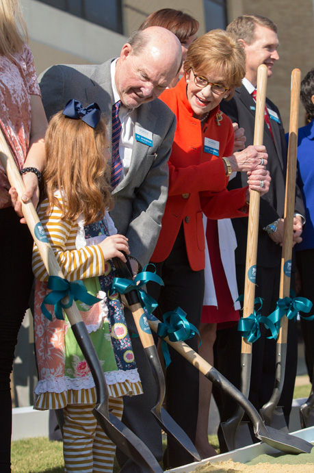 Joe and Kathy Sanderson, co-chairs of the Campaign for Children's of Mississippi, help Batson Children's Hospital patient Avery Bell in breaking ground on the new children's tower.