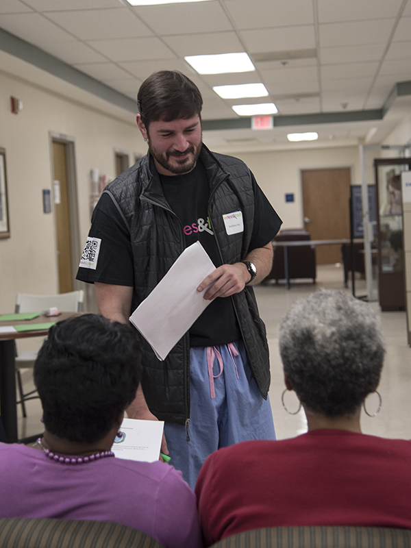 Volunteer Matthew Alias, a first-year medical student, prepares to escort a woman to her first screening.