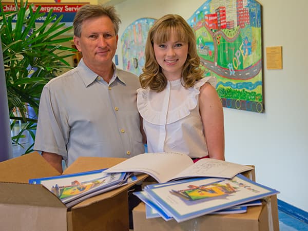 Jack and Emma Herrington brought thousands of Color My Cares coloring books to Batson Children's Hospital June 30. The books include lighthearted images and Mississippi scenes as well as pages for journaling.
