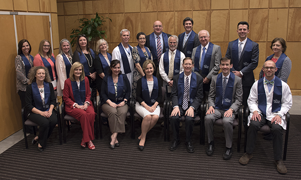 Nelson Order inductees include, back row from left, Dr. Michelle Palokas, Katie Hall, Dr. Janet Harris, Tina Ferrell, Dr. Marianne Conway, Dr. James Brantley, Dr. Susan Warren, Dr. Scott Phillips, Dr. David Brown, Dr. Joshua Fleming, Dr. Bela Kanyicska, Dr. Corey Jackson and Dr. Janet Slaughter; and front row from left, Dr. Lique Coolen, Dr. Sherry West, Asher Street,  Dr. Penny Rogers, Daley, Dr. Calvin Thigpen and Dr. Zeb Henson.
