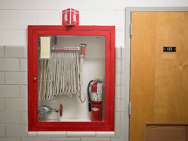 Accessible fire extinguishers and hoses throughout the Medical Center help employees and students take needed action in an emergency.