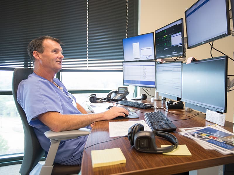 Elliott Moore, an e-Intensive Care Unit nurse, adds a second set of eyes to patient care in the Conerly Critical Care Tower. The standard of care and record of leadership at the Center for Telehealth has led to UMMC being named a Telehealth Center of Excellence.