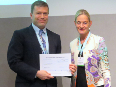 Pugh, left, accepts the award for Most Innovative Paper of 2016 from Planta Medica in Basel, Switzerland, on Monday, Sept. 4. Submitted photo