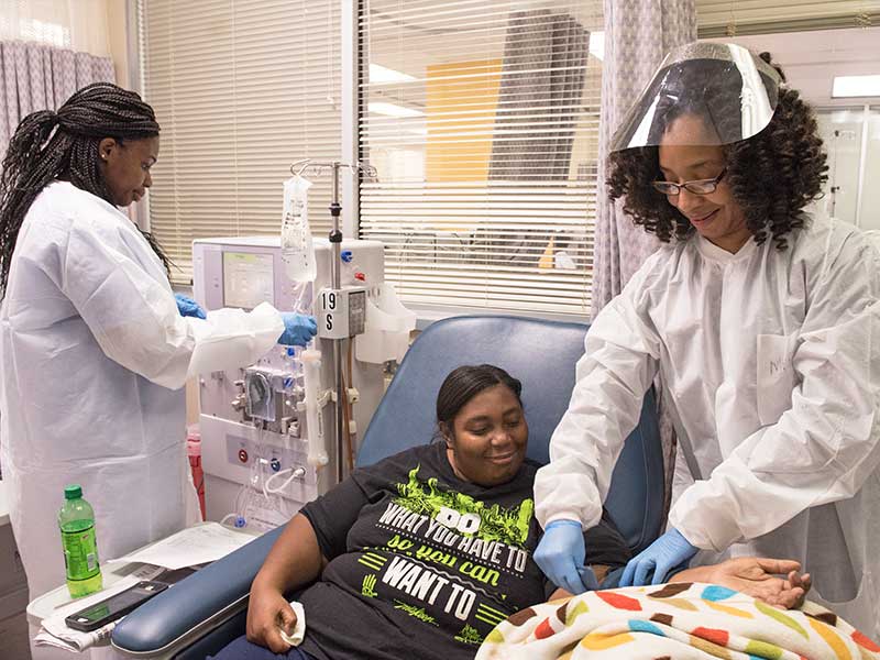 Demetra Hamblin, center, undergoes kidney dialysis on the main campus with assistance from dialysis technicians Shekela Simpson, left, and Mary Hayes. Hamblin normally receives her dialysis at the Jackson Medical Mall.
