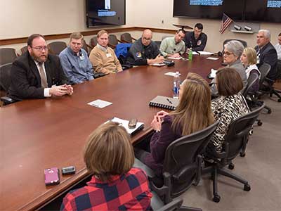 Chief Administrative Officer Jonathan Wilson (top left) briefs an administrative team Friday about relocating the Medical Center's clinical operations at the Jackson Medical Mall.