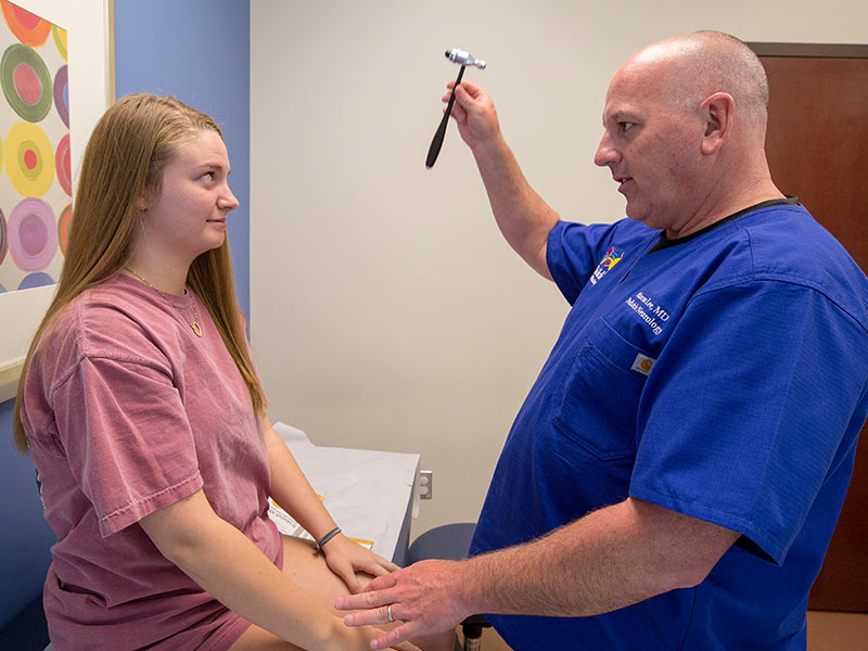   With her eyes, Kate Brown of Lucedale follows the instrument in Dr. Mark Lee's hand during a check-up at the Children's of Mississippi specialty clinic in Biloxi.