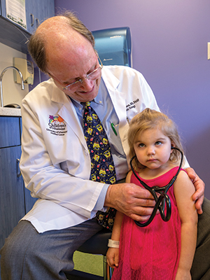 Harmon listens to the heart of Children’s of Mississippi patient Caleigh Kelly of Mount Olive during a clinic visit.