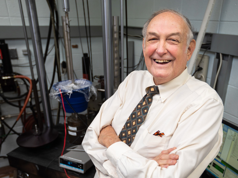 Dr. Lyle Zardiackas, first chair of the Department of Biomedical Materials Science at UMMC, stands in the biomedical materials testing laboratory that he built in 2004.