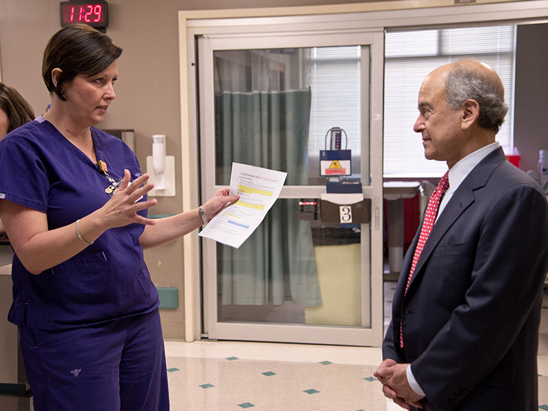 Dr. Mark Chassin, CEO and president of The Joint Commission, talks with surgical ICU nurse manager Kim Horn during his 2015 visit to the Medical Center.