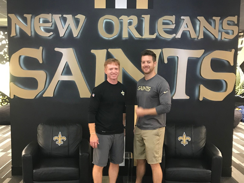 Beau Lowery, left, the Saints’ director of sports medicine, is an alumnus from the School of Health Related Professions