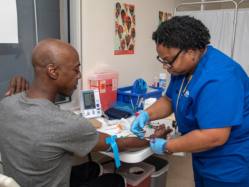 Sharron Vaughn. UMMC biobank recruiter, draws blood from Travis Key of Jackson for the All of Us research study.