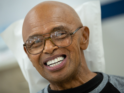 Smiling patient after he has received new dentures.