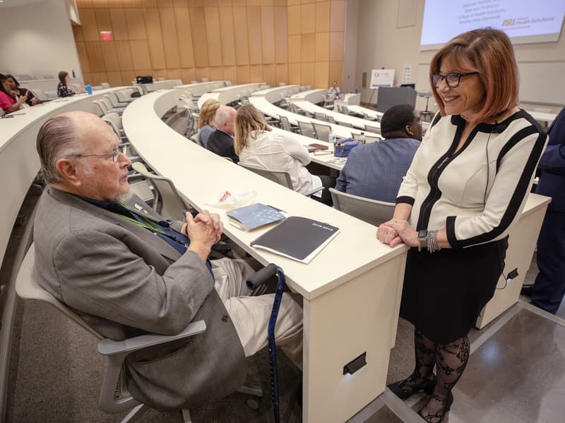 Dr. John Bower, former UMMC nephrologist and namesake of the School of Population Health, speaks with Dr. Deborah Helitzer, Dean of the College of Health Solutions at Arizona State University prior to her lecture.
