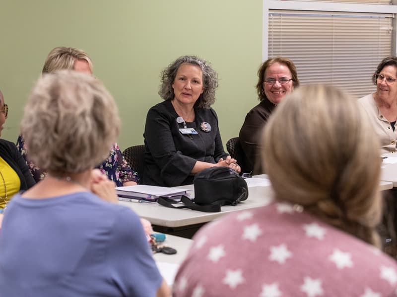 Ellen Hansen, chief nursing officer at Batson Children's Hospital, talks with FAST members and hospital leaders during the group's April meeting.