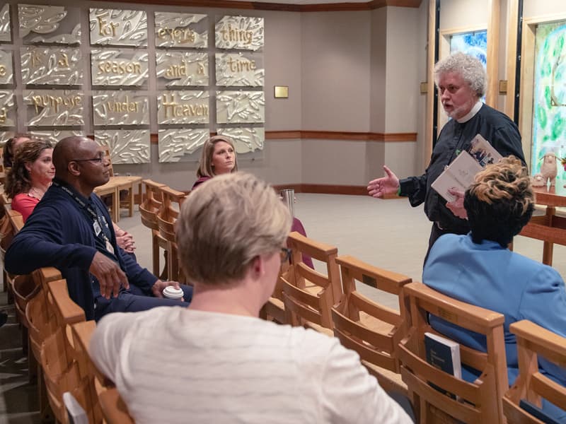 Hospital chaplain Jeffery Murphy talks with clergy, FAST members and hospital leaders during an informational program held earlier this month.