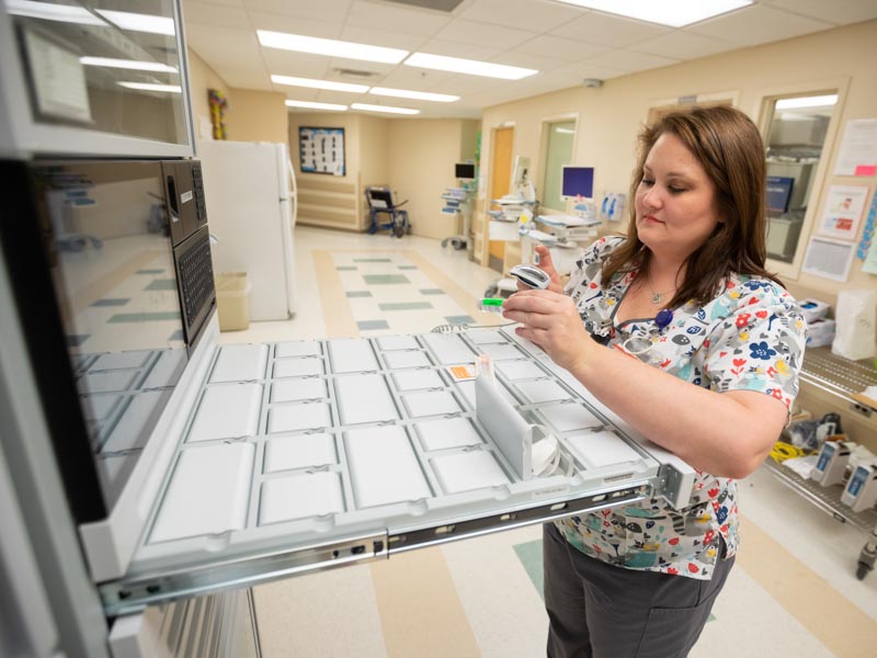 Brandy Bryant, a 5 South nurse, prepares a patient's dose of insulin.