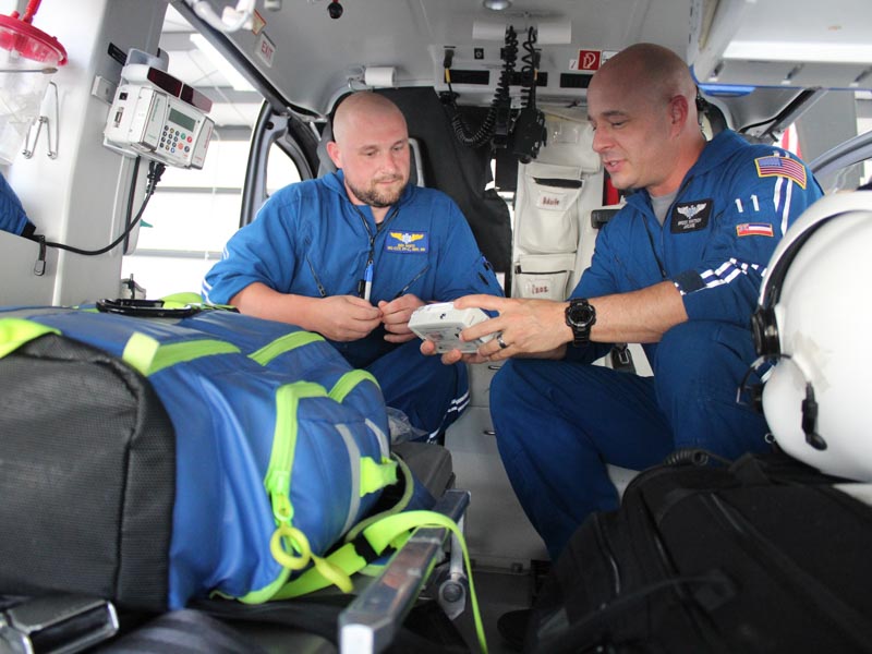 AirCare 2 flight paramedic Ben White and flight registered nurse Brock Whitson check equipment before transporting a patient. Bill Graham/The Meridian Star