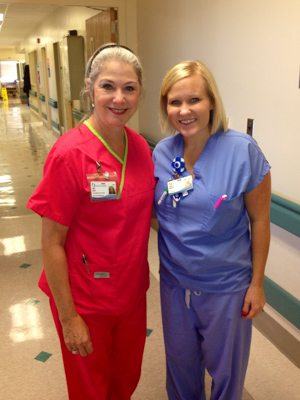 Janet Harris poses with Christy Barrick, then a nurse in intensive care, after a morning working alongside her on the hospital floor.