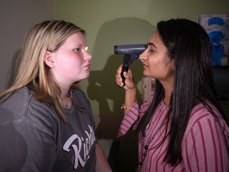 Dr. Riddhiben Patel gives migraine patient Kalli Dykes of Richton an exam during a headache clinic day at the Children's of Mississippi Specialty Clinic.
