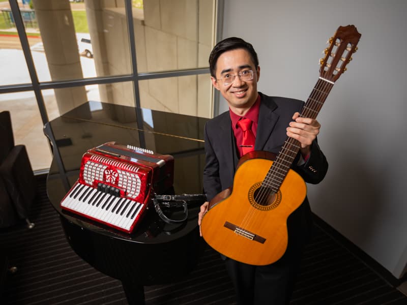 Dr. Frank Han plays a variety of musical instruments, including the piano, accordion and classical guitar.